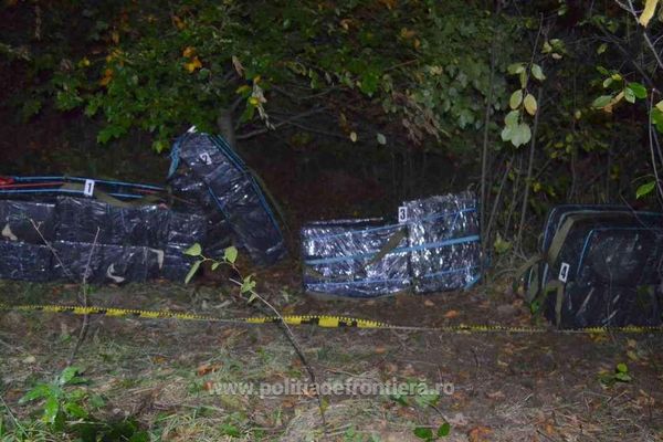 Focuri de armă și aproape 12.000 pachete cu țigări confiscate FOTO
